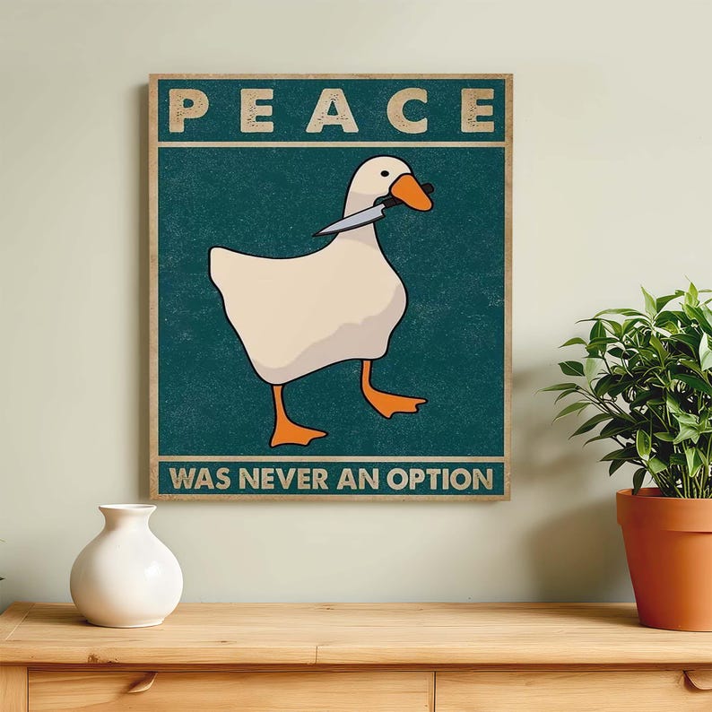 May include: A vintage-style poster featuring a white goose holding a knife in its beak. The poster has a teal background with the text "PEACE WAS NEVER AN OPTION" in white.