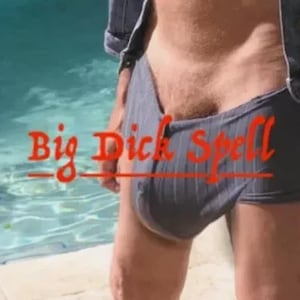 May include: Gray boxer briefs with vertical stripes. The text "Big Dick Spell" is written in red across the image. The person is wearing a denim jacket.