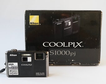 Vintage Nikon COOLPIX S1000pj Compact Point-and-shoot digital camera w/ built-in MINI-PROJECTOR