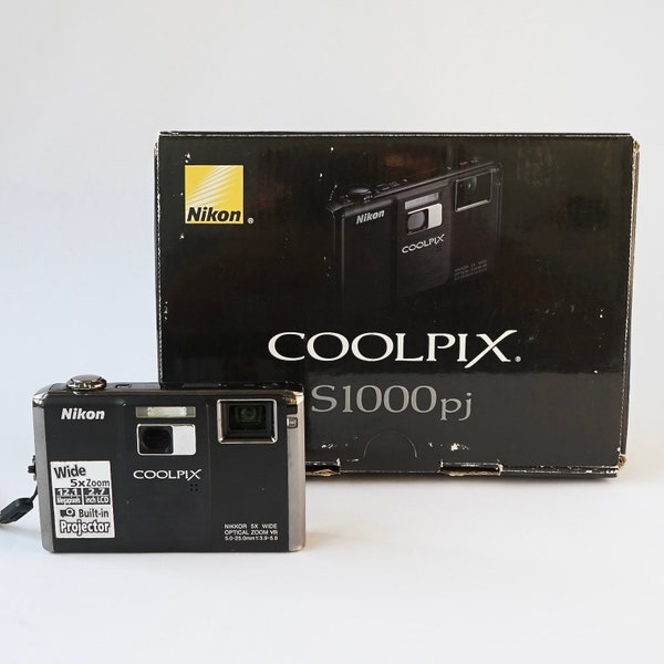 Vintage Nikon COOLPIX S1000pj Compact Point-and-shoot digital camera w/ built-in MINI-PROJECTOR