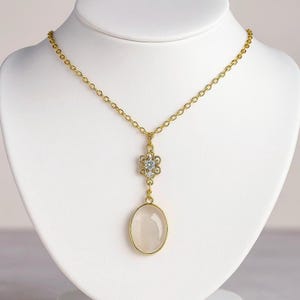 Clear Quartz Necklace: Gold-Plated Crystal Pendant with Floral Charm