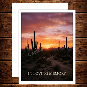 May include: A white card with a desert sunset scene featuring cacti and a dirt path. The text "IN LOVING MEMORY" is displayed below the image. The Cactus Barrel Co. logo is at the bottom.