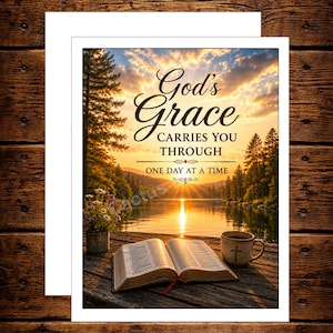 May include: A greeting card featuring an open Bible, a mug with a cross, and a small vase of flowers on a wooden dock overlooking a lake at sunset. The text reads: God's Grace CARRIES YOU THROUGH ONE DAY AT A TIME. The brand name Cactus Barrel Co. is visible.