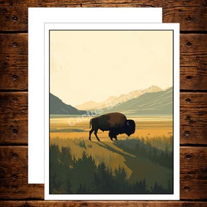 May include: A rectangular art print featuring a brown bison standing in a grassy field with dark green trees in the foreground and mountains in the distance. The text Cactus Barrel Co. is visible across the center of the illustration.