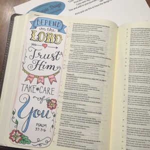 May include: A colorful hand-drawn bookmark with the words "Depend on the Lord, Trust Him, and Take Care of You" and the Bible verse Psalm 37:3-6. The bookmark is decorated with flowers and banners.