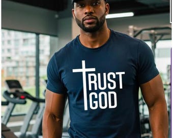 May include: A navy blue t-shirt with a white cross and the text "TRUST GOD" printed on the front.