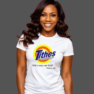 May include: White t-shirt with a graphic that says "Tithes and Offering" in blue and yellow, with the question "Will a man rob God?" and the reference Malachi 3:8. The shirt is worn by a person with dark hair.