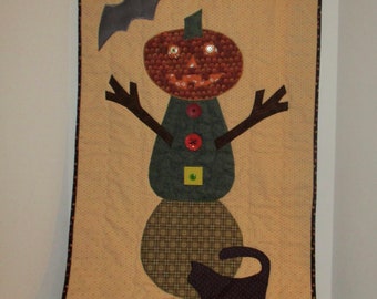 Pumpkin Man Wall Hanging 18 inches wide by 29.5 inches high. Black cat and bat to boot.