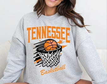 May include: Gray sweatshirt with a graphic of a basketball going through a hoop with the text "Tennessee Basketball" printed on the front.