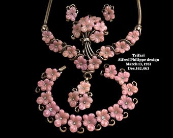 pink trifari jewelry logo