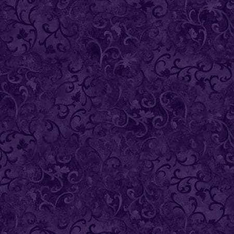 The image is a dark purple fabric with a repeating pattern of swirls and leaves.