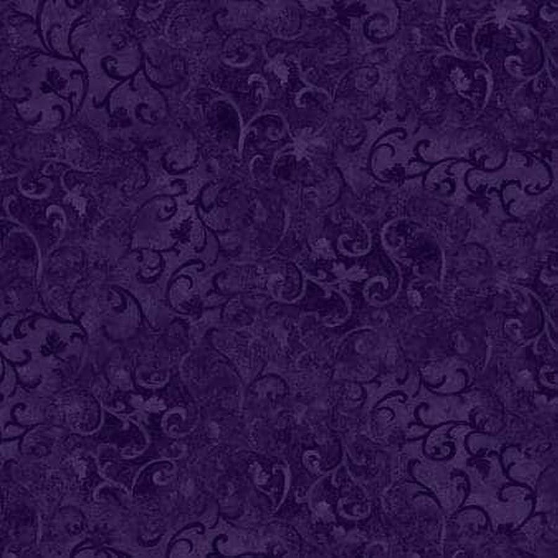 The image is a dark purple fabric with a repeating pattern of swirls and curves, creating a visually striking and intricate design.