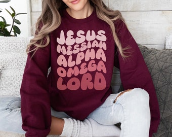 Jesus Messiah Unisex Heavy Blend Crewneck Sweatshirt, Front Print Big Bubble letters Names of God in gradient muted dusty rose, pale peach