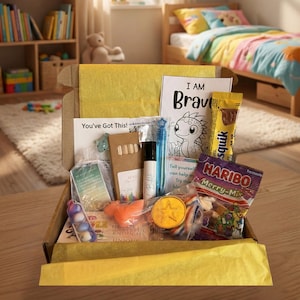 May include: A white ceramic mug with a black handle and the text "But First, Coffee" in a bold, black font. The mug is set against a blurred background, highlighting its clean design.