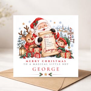 May include: A square Christmas greeting card featuring an illustration of Santa Claus, a reindeer, and an elf holding a scroll titled Santa's Nice List with the name George. Text reads Merry Christmas to a magical little boy and George.