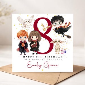 May include: A square birthday card featuring a large dark red number 8, cartoon illustrations of four characters, an owl, and a golden snitch. Text reads: HAPPY 8TH BIRTHDAY TO A MAGICAL DAUGHTER, and the name Emily Grace in a script font.