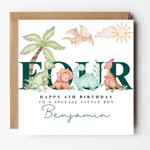 May include: A birthday card with a brown envelope. The white card features the word "FOUR" in dark green, with watercolour dinosaurs. Text reads "Happy 4th Birthday to a special little boy" and the name "Benjamin".