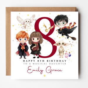 May include: A square birthday card with a brown envelope. The card features illustrations of characters from a fantasy series, a large number 8, and the text "Happy 8th Birthday to a Magical Daughter" and a name.
