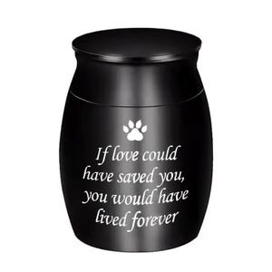 May include: Black urn with a paw print and the inscription "If love could have saved you, you would have lived forever".