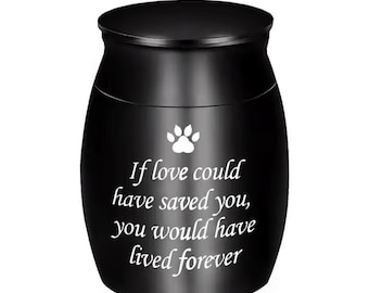 May include: Black urn with a paw print and the inscription "If love could have saved you, you would have lived forever".