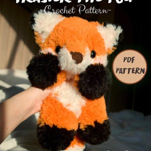 May include: A plush fox toy with orange, white, and black fur, featuring dark eyes and a brown nose. Text reads: FRASIER THE FOX Crochet Pattern, PDF PATTERN, and IG: MEGS_CROCHET_FRIENDS. This is a digital guide for creating a stuffed animal fox.
