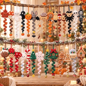 May include: A collection of crocheted hanging ornaments featuring various seasonal designs including autumn leaves, pumpkins, ghosts, bats, Christmas trees, candy canes, gingerbread houses, and festive characters, each with a spiral tail.