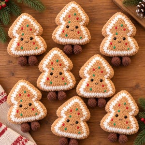 May include: Seven crocheted gingerbread tree ornaments with fuzzy brown bodies, white yarn trim, and small colorful embroidered dots. Each tree features a smiling face with black eyes and two small brown crocheted feet dangling at the bottom.