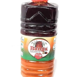 May include: A large plastic bottle of Banga Red Palm Oil. The bottle is red and orange and has a green label with the brand name "Banga" and the words "Red Palm Oil" printed on it. The label also states that the oil is cholesterol free.