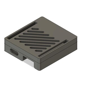 May include: A gray, angular electronic device enclosure with a slatted top and side cutouts. The design features a rectangular base with a triangular top, and a small port on the side.