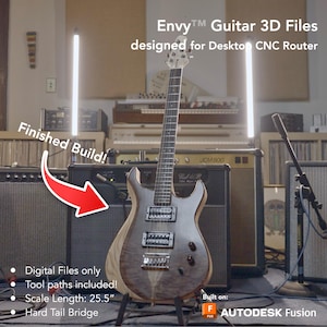 May include: A finished build of a black and brown electric guitar with a hard tail bridge. The guitar is 25.5 inches long and was built using Autodesk Fusion 360 software. The guitar is in front of a black amplifier with the text "JCM800" on it. The text "Envy&trade; Guitar 3D Files" and "designed for Desktop CNC Router" is at the top of the image. The text "Finished Build!" is in red and is pointing to the guitar with a red arrow.