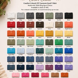 May include: A Comfort Colors 1717 color chart displaying a grid of folded t-shirts in various shades. The text includes the brand name, model number, fabric composition, size range, and a list of color names beneath each corresponding shirt sample.