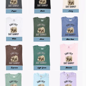 May include: A collection of t-shirts in various colors, each featuring a graphic of a bear and the text "CAN I PET DAT DAWG?". Colors include pepper, black, ivory, white, moss, blue jean, espresso, light green, blossom, bay, chambray, and orchid.