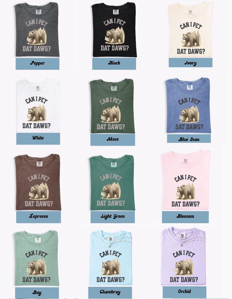 May include: A collection of t-shirts in various colors, each featuring a graphic of a bear and the text "CAN I PET DAT DAWG?". Colors include pepper, black, ivory, white, moss, blue jean, espresso, light green, blossom, bay, chambray, and orchid.