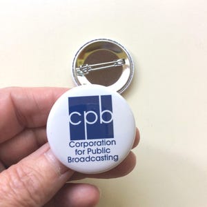 Corporation for public broadcasting save my public radio. Wear a pin. Show your support for PBS and NPR. One and a half inch