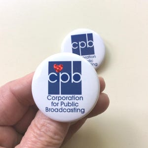 Corporation for public broadcasting save my public radio. Wear a pin. Show your support for PBS and NPR. One and a half inch pin