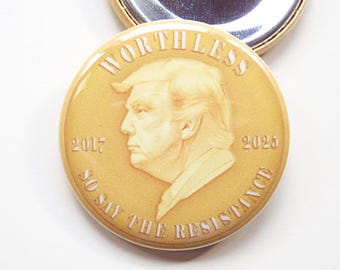 1.5" lapel pin; Trump presidential gold coin. Worthless...So Say The Resistance.