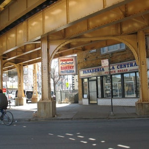 Logan Square, Chicago Photo, Chicago Art, Chicago Photography, bakery, the El, panaderia, mexican, elevated train, sunlight, bicycles, wall