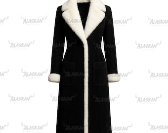 May include: A long black coat with white faux fur trim on the collar, cuffs, and down the front edges. The coat has two pockets and a classic, tailored design. The coat is a stylish outerwear garment.