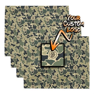 May include: Four sheets of camouflage wrapping paper with a space for a custom logo. The paper is green, brown, and beige with a camouflage pattern. The text "YOUR CUSTOM LOGO" is in orange letters.