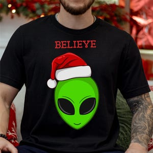 Santa Alien Short Sleeve Tee, Believe Design, Holiday Gift, Christmas Apparel, Unique Fun Alien Shirt, UFO Alien with Santa Hat