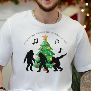 Christmas Bigfoot Tee, Funny Holiday Shirt, Sasquatch Christmas Gift, Squatchin Around the Christmas Tree Humorous Yeti T-shirt