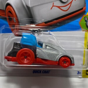 May include: A toy car labeled "Quick Chat" with a silver body, red wheels, and a blue top. The car is packaged on a blue and yellow card with the number "9/10" and a "3+" age recommendation.