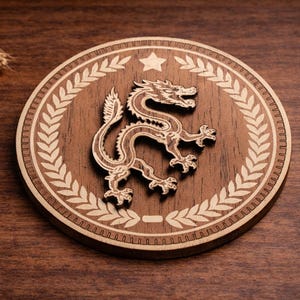 May include: A round wooden coaster with a laser-cut design. The coaster features a detailed dragon in the center, surrounded by a laurel wreath and a star. The coaster is made of dark brown wood with lighter wood accents.