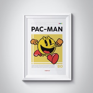 Könnte beinhalten: Ein weiß gerahmtes Poster mit gelbem Hintergrund, auf dem ein Pac-Man-Cartoon-Charakter abgebildet ist. Das Poster trägt den Text "PAC-MAN" in Schwarz und "'80" in Schwarz unten. Der Text "NAMCO" steht in Schwarz unten auf dem Poster.
