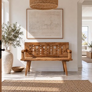 May include: A wooden bench with a high backrest featuring a repeating geometric cutout pattern of circles and diamonds. The bench has straight armrests and four angled legs, crafted from light brown wood with a visible grain and smooth finish.