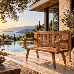 May include: A rustic wooden bench featuring a backrest with a repeating geometric cutout pattern, sturdy armrests, and four angled legs. The bench is constructed from weathered, light brown timber with a visible grain and a natural, textured finish.