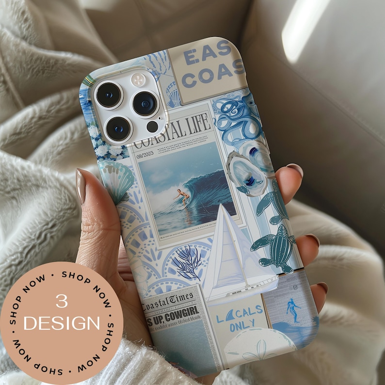 May include: A phone case with a coastal theme. The design features images of a surfer, seashells, and sailboats in shades of blue and white. The case includes the text "COASTAL LIFE" and "EAS COAS". A circular sticker says "3 DESIGN".