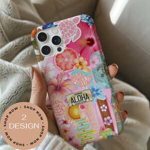 May include: A phone case with a vibrant tropical design. The case features a pink background with floral and beach-themed graphics, including hibiscus flowers, a surfboard, and the text "ALOHA". The case also has the text "HERE COMES THE SUN".