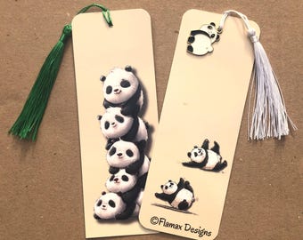 May include: Two panda-themed bookmarks. One bookmark features a stack of panda bears, and the other has panda illustrations. Both have tassels. The text "Flamax Designs" is printed on one bookmark.