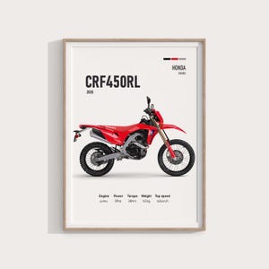 May include: A framed print featuring a red Honda CRF450RL motorcycle. The image includes technical specifications: 449cc engine, 38hp power, 38Nm torque, 132kg weight, and a top speed of 145km/h. The year 2025 is also displayed.